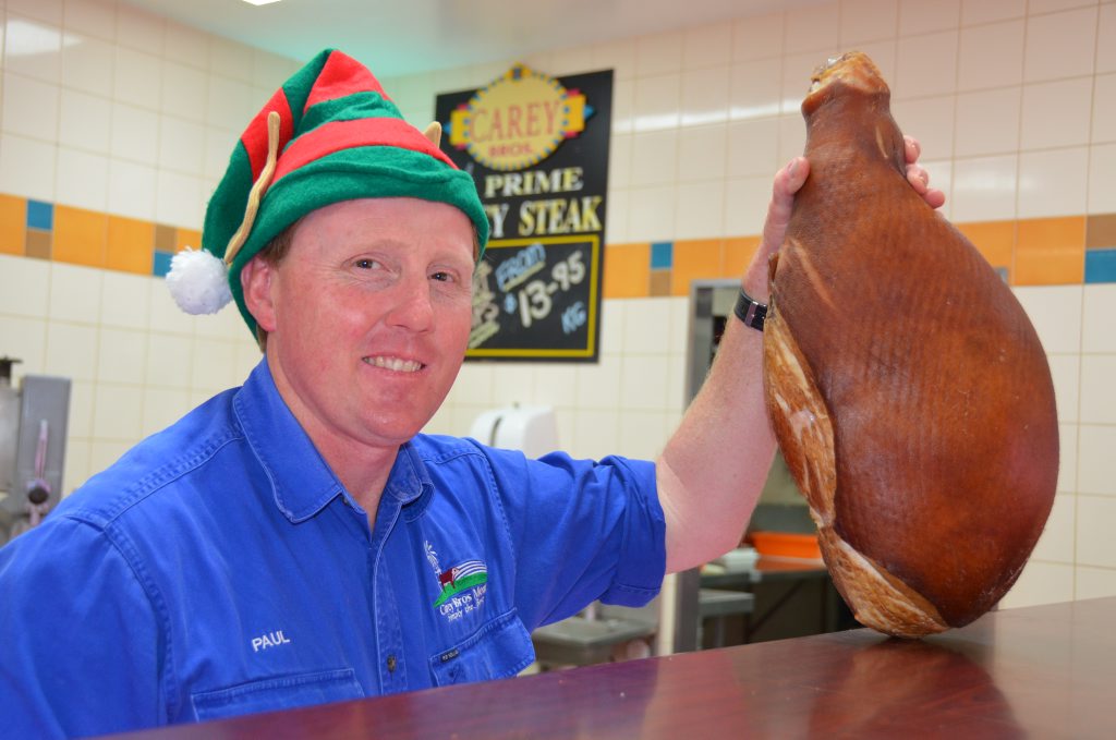 HIS HAMLINESS: Paul Carey reckons the Christmas hams are as good quality as ever, and ready to serve up on Christmas Day. Photo Georja Ryan / Warwick Daily News